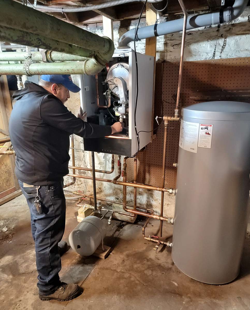 technician installing boiler
